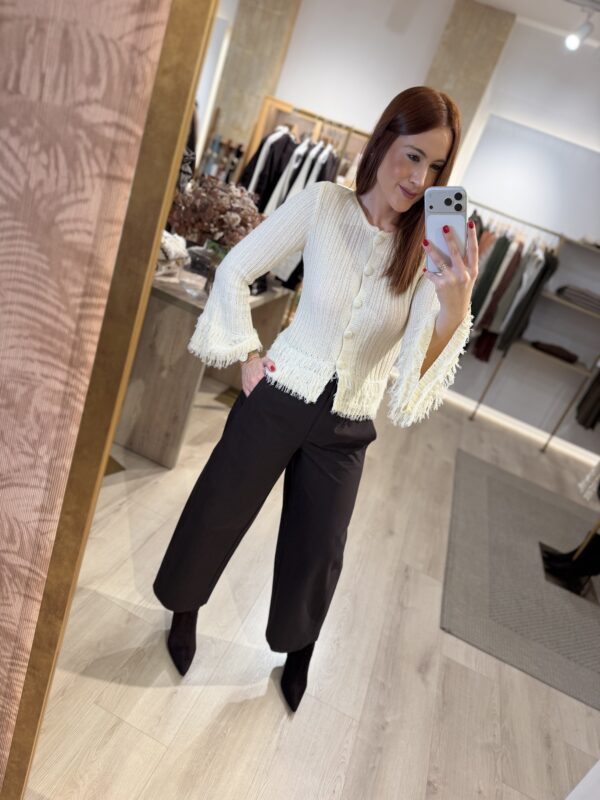 Cardigan crudo flecos.